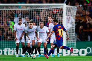 Caption: Master At Work - Lionel Messi At A Free Kick Moment Wallpaper