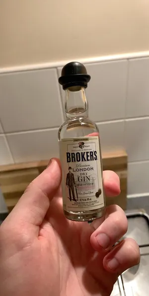 Caption: Miniature Brokers Gin Bottle Wallpaper
