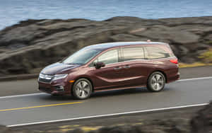 Caption: Modern Honda Odyssey In Action Wallpaper