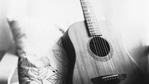 Caption: Monochrome Magic: The Beauty Of A Black And White Guitar Wallpaper
