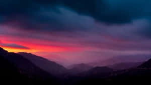 Caption: Mysterious Dark Mountain Under The Night Sky Wallpaper