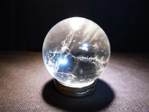 Caption: Mystic Crystal Ball On Dark Background Wallpaper