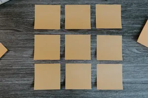 Caption: Neatly Arranged Sticky Notes On A Board Wallpaper