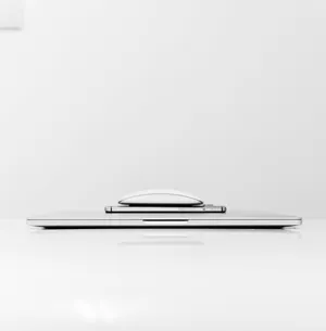 Caption: Organized Gadgets On Desk Wallpaper