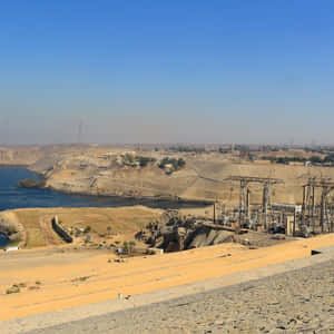 Caption: Panoramic View Of Aswan High Dam, Egypt Wallpaper