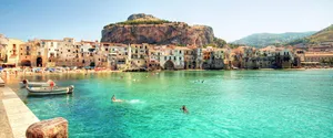 Caption: Picturesque Italian Island With Crystal Clear Waters Wallpaper