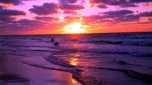 Caption: Picturesque Sunset At Tropical Beach Wallpaper