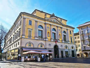 Caption: Picturesque View Of Lugano, Switzerland Wallpaper
