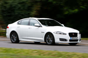 Caption: Powerful And Luxurious Jaguar Xf With Stunning Backdrop Wallpaper