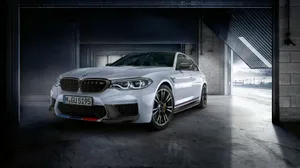 Caption: Powerful Elegance: A Stunning Bmw M5 In Motion Wallpaper