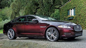 Caption: Powerful Performance And Luxury - The Jaguar Xj Wallpaper