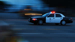 Caption: Pristine Ford Crown Victoria On An Open Road Wallpaper