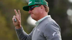 Caption: Professional Golfer - William Mcgirt Making A Peace Sign Wallpaper