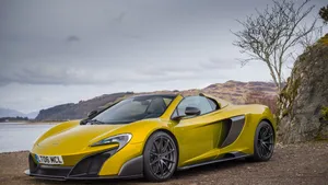 Caption: Ravishing Mclaren 675lt On The Go Wallpaper