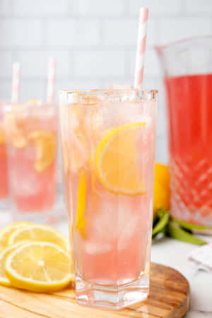 Caption: Refreshing Pink Lemonade In A Glass Wallpaper