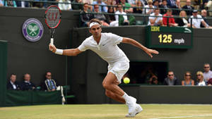 Caption: Roger Federer In Action At The Iconic Wimbledon Court Wallpaper