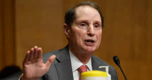 Caption: Ron Wyden Wearing Gray Suit Wallpaper