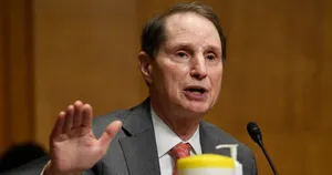 Caption: Ron Wyden Wearing Gray Suit Wallpaper
