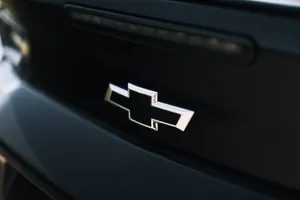 Caption: Rugged Chevrolet Pickup Truck On Mountain Road Wallpaper