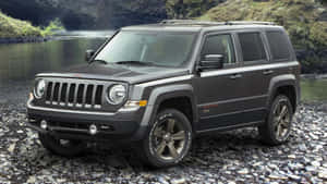 Caption: Rugged Jeep Patriot Suv On An Off-road Adventure Wallpaper