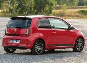 Caption: Scenic Drive With A Sky Blue Skoda Citigo Wallpaper