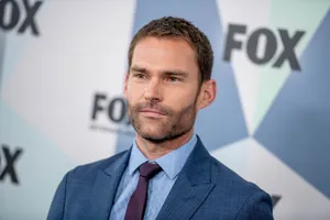 Caption: Seann William Scott Posing For A Photo Wallpaper