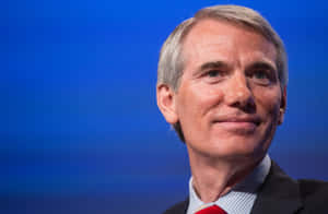 Caption: Senator Rob Portman Smiling Close-up Wallpaper