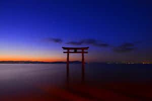 Caption: Serene Shinto Shrine Surrounded By Nature Wallpaper