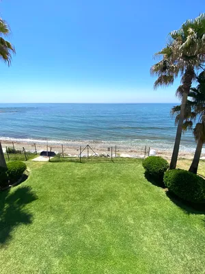 Caption: Serene Tropical Beach Resort Wallpaper