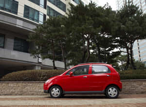 Caption: Silver Daewoo Matiz On Highway Wallpaper