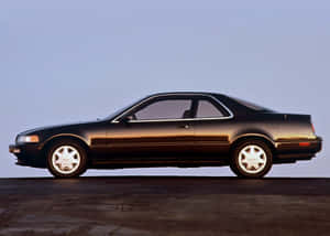 Caption: Sleek Acura Legend Cruising The Night Wallpaper