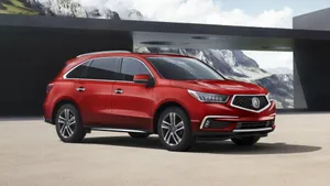 Caption: Sleek Acura Mdx Suv Cruising On The Road Wallpaper