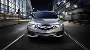 Caption: Sleek Acura Rdx In A Scenic Landscape Wallpaper