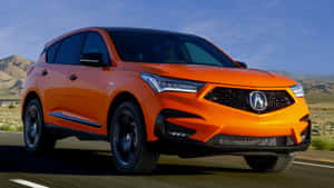 Caption: Sleek Acura Rdx On The Open Road Wallpaper