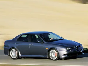 Caption: Sleek Alfa Romeo 156 In Motion Wallpaper
