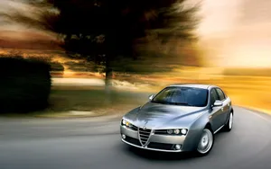 Caption: Sleek Alfa Romeo 159 Showcasing Italian Automotive Design Excellence Wallpaper
