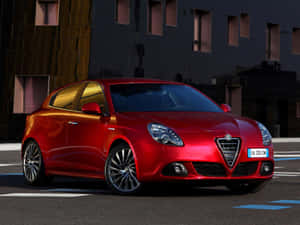 Caption: Sleek Alfa Romeo Giulietta In Stunning Scenery Wallpaper