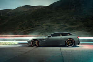 Caption: Sleek And Elegant Ferrari Gtc4lusso In Action Wallpaper