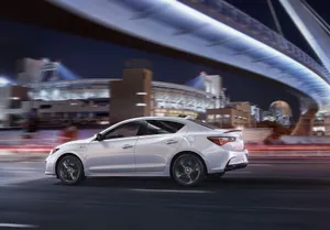 Caption: Sleek And Luxurious Acura Ilx Sedan In Action Wallpaper