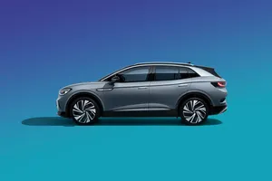 Caption: Sleek And Modern Volkswagen Id 4 On The Open Road Wallpaper