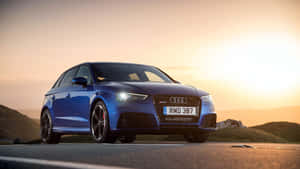 Caption: Sleek And Powerful Audi Rs3 On The Road Wallpaper