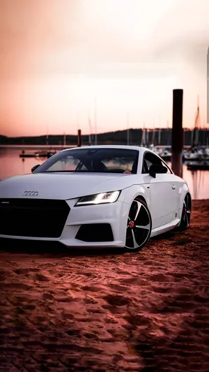 Caption: Sleek And Powerful Audi Tt Rs On The Road Wallpaper