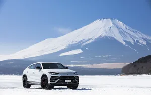 Caption: Sleek And Powerful Lamborghini Urus In Action Wallpaper