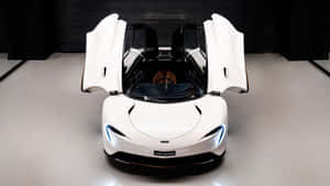 Caption: Sleek And Powerful Mclaren Speedtail On The Road Wallpaper