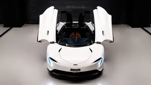 Caption: Sleek And Powerful Mclaren Speedtail On The Road Wallpaper