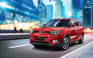 Caption: Sleek And Powerful Ssangyong Suv Adventure Wallpaper