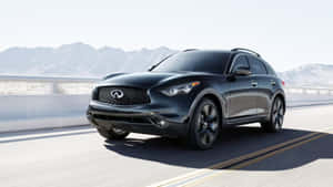 Caption: Sleek And Rugged Infiniti Qx70 In Urban Setting Wallpaper