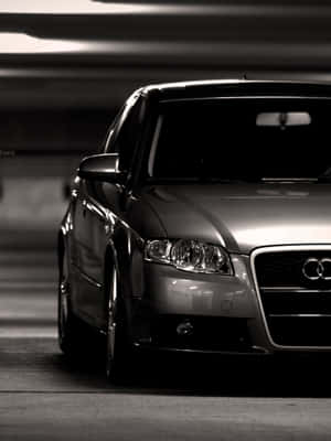 Caption: Sleek And Sophisticated Audi A4 In Action Wallpaper