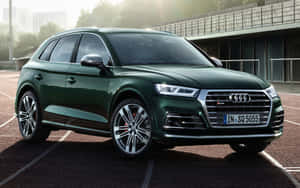 Caption: Sleek And Sophisticated Audi Sq5 On The Road Wallpaper