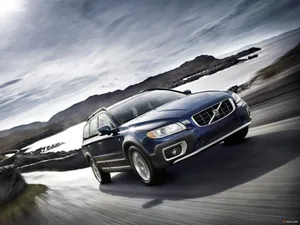 Caption: Sleek And Sophisticated Volvo V70 On The Move Wallpaper